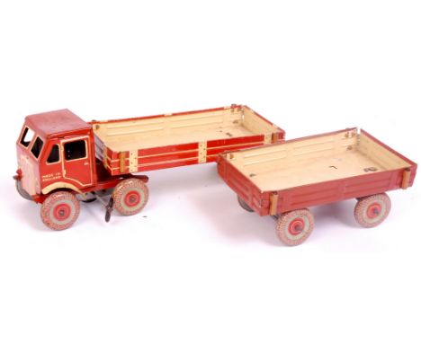 Mettoy Tinplate 6 wheel articulated tractor unit and trailer, finished in brown and cream with fixed key clockwork operation,