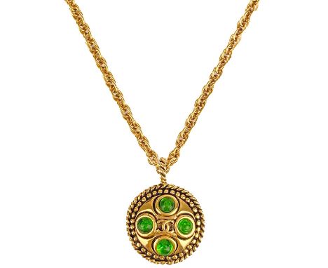 A Chanel 24ct gold-plated green Gripoix set pendant necklace, early 1980's. The double sided pendant with CC and eight green 