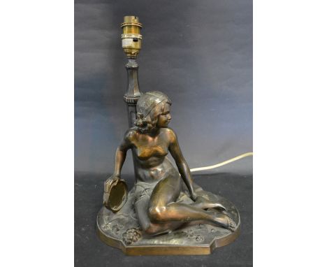 An Art Deco Style Spelter Table Lamp, in the form of a girl with tambourine, signed H.A., 32 cms tall