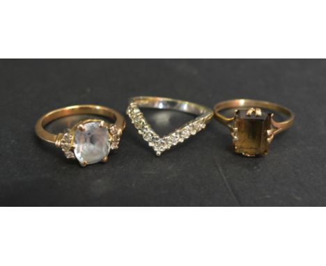 A 9ct. Gold Diamond Set Band Ring of Shaped Form, together with two other 9ct. gold dress rings