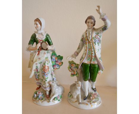 A Pair of Sitzendorf Porcelain Figures in the form of a lady and gentleman in period dress decorated in polychrome enamels an