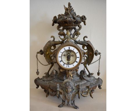 A Late 19th Century French Gilt Metal Mantle Clock, the enamel dial with visible escapement and Roman numerals, 38 cms tall