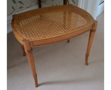 A 19th Century Satinwood Stool with a cane top and moulded frieze raised upon ring turned outswept legs, 54 x 40 cms