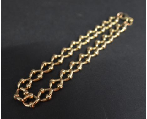 A 9ct. Gold Curb Link Bracelet, 16.3 gms.