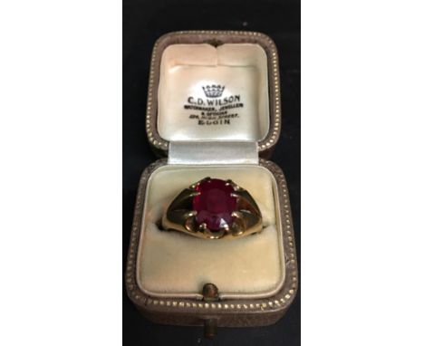 An 18ct. Gold Ring Set Large Oval Synthetic Ruby