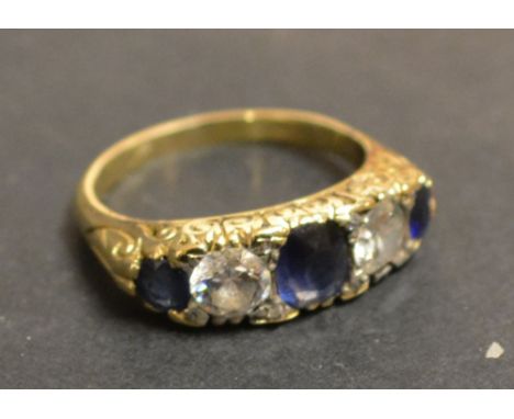 An 18ct. Yellow Gold Victorian Sapphire and Diamond Band Ring, set with two large diamonds and three sapphires within a pierc