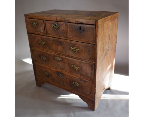 A George I Walnut Chest of Three Short and Three Long Drawers with Brass Handles and Escutcheons, raised upon bracket feet, 9