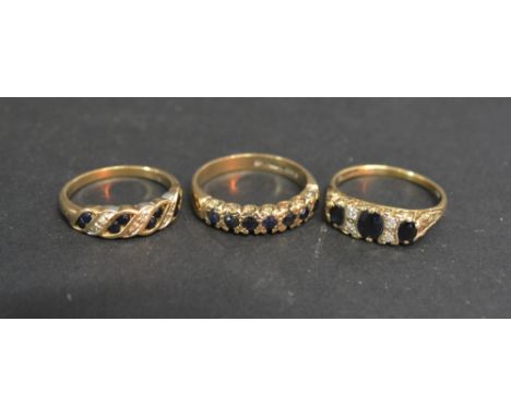 A 9ct. Gold Sapphire and Diamond Band Ring together with two other similar dress rings