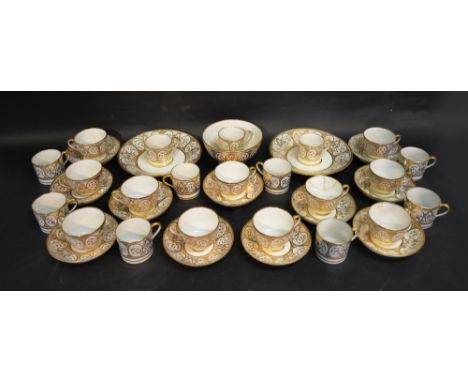 An Early 19th Century English Tea and Coffee Service with a gilded decoration upon a white ground comprising cups, saucers, d