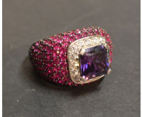 A Cocktail Dress Ring, set with red, purple and clear stones