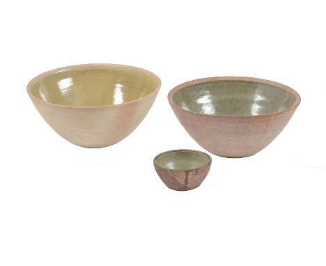 λ BERNARD LEACH (BRITISH 1887-1979)THREE ST. IVES POTTERY BOWLS,Variously glazed in shades of green glazeImpressed seal marks