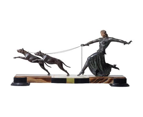 AN ART DECO ALABASTER AND PATINATED METAL GROUP OR CENTREPIECECIRCA 1925Probably depicting a stylised Diana and her hounds, o