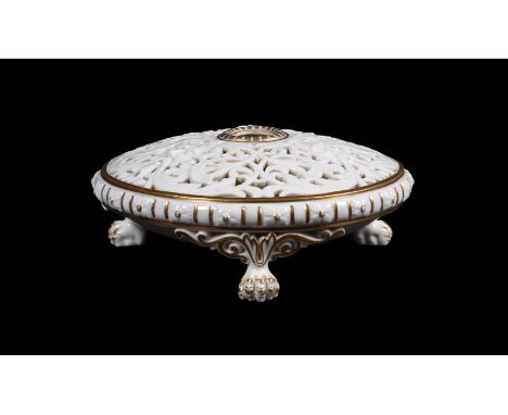 A GRAINGER'S WORCESTER RETICULATED POT POURRI URNCIRCA 1880 Of round, compressed form on three paw feet, enriched with gildin