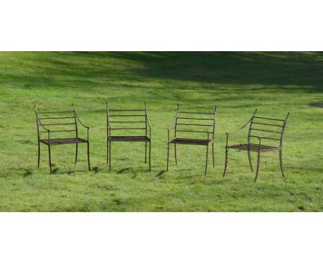 A SET OF FOUR IRON GARDEN CHAIRSOF RECENT MANUFACTUREEach with a ball finial above the bar back86cm high, 54cm wide
