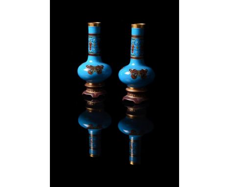 CHRISTOPHER DRESSER FOR MINTONA PAIR OF AESTHETIC MOVEMENT BLEU CELESTE BOTTLE VASESCIRCA 1870Of globe and shaft form on inte