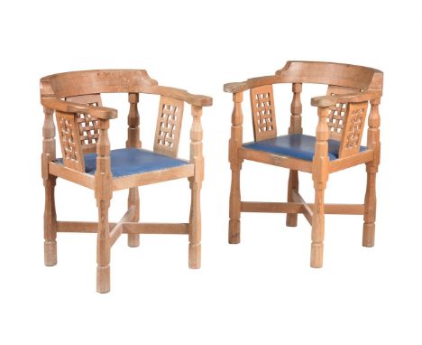 WORKSHOP OF ROBERT 'MOUSEMAN' THOMPSON (KILBURN), A PAIR OF OAK 'MONK'S CHAIRS' Each with curved back and shaped arms, over t