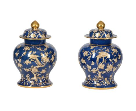 A PAIR OF SPODE COPELAND'S CHINA BLUE GROUND AND GILT DECORATED URNS AND COVERSFirst quarter 20th centuryOf baluster form, de
