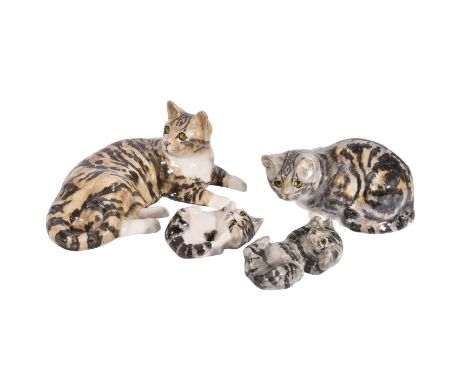 λ A GROUP OF FOUR ASSORTED WINSTANLEY MODELS OF TABBY CATSTHIRD QUARTER 20TH CENTURYComprising; model no. 7 (recumbant), 33cm