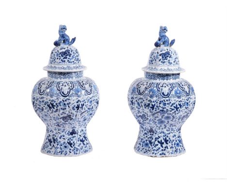 A PAIR OF DUTCH DELFT BLUE AND WHITE BALUSTER VASES AND COVERSLATE 19TH CENTURYEach decorated with all over ground of flowers