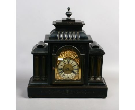 A German ebonized 14 day mantle clock with brass dial and chiming on a coiled gong