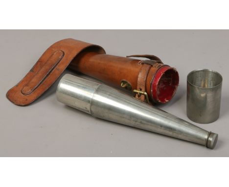 A hunting flask and tumbler in tan leather case by James Dixon of Sheffield, 25.5cm.   Condition Report. To be used as a guid