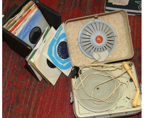 A vintage French portable Pipo record player along with record carry case and contents of single records, Beatles, Rolling St