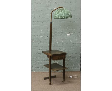 An oak telephone table with lamp.
