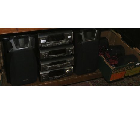 A Technics stereo hifi stacking system with remote and manual and a Dolby Pro-Logic movie surround sound system.