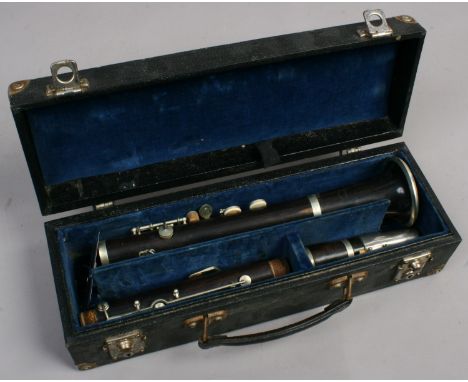 A French clarinet in case stamped Buisson Paris.