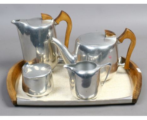 A vintage picquot ware four part tea service on associated tray.
