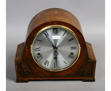 An oak cased Westminster chime mantle clock with silvered dial and Roman numeral markers   Condition Report. To be used as a 