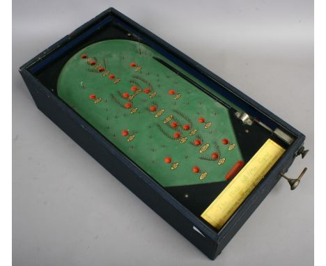 A vintage Pixie pin game bagatelle board