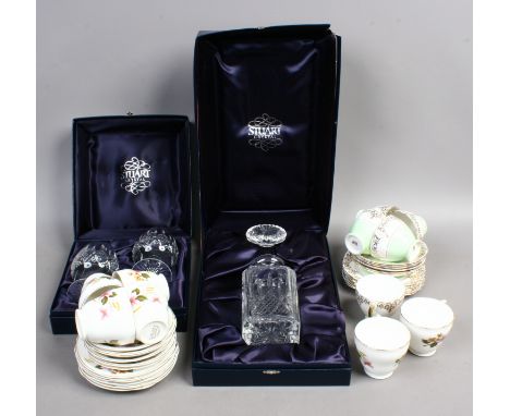 A boxed Stuart crystal decanter and a pair of brandy glasses and two vintage china tea sets 