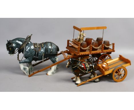 A ceramic model of a dapple grey shire horse and brewery dray along with a Melbaware shire and dray.