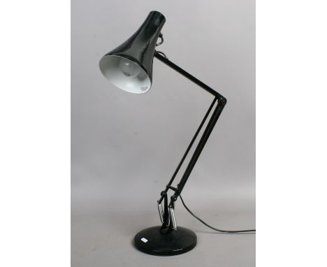 A black anglepoise lamp.