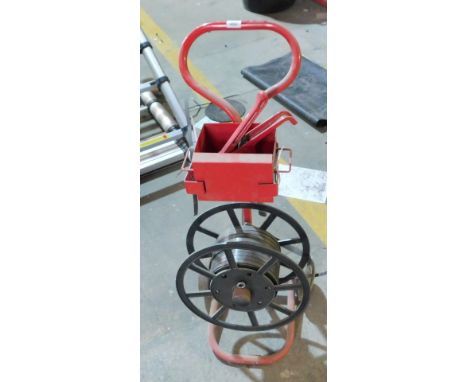 A pallet banding machine. VAT is also payable on the hammer price of this lot.