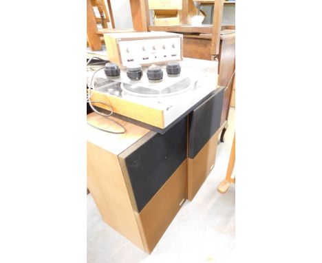 A vintage Leak turntable, with separate stereo amplifier, and two speakers with cassette rack.