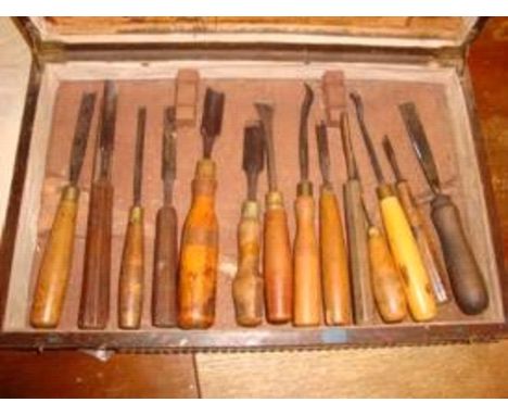 Circa 60 hand carving tools, including beech wood handled examples.