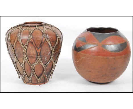 2 large African tribal ceramic bowl vases - planters. One in pigment dye colours, the other with rattan applied bindings