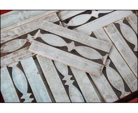 A collection of Art Nouveau ceramic tiles in two different sizes being marked to the underside with makers name. ( 31 large a