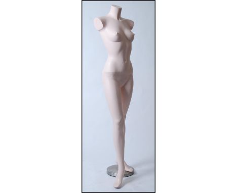 An Adel Rootstein style mannequin of female form , full life size on a heavy chrome base , fully freestanding. 165cm high