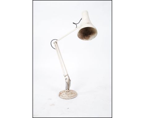 A vintage post war Herbert Terry anglepoise desk lamp raised on circular base with pendant shade and angular arm