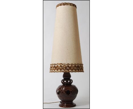 A large 1970's West German fat lava type table lamp having large conical shade in fully working order. 109cm high