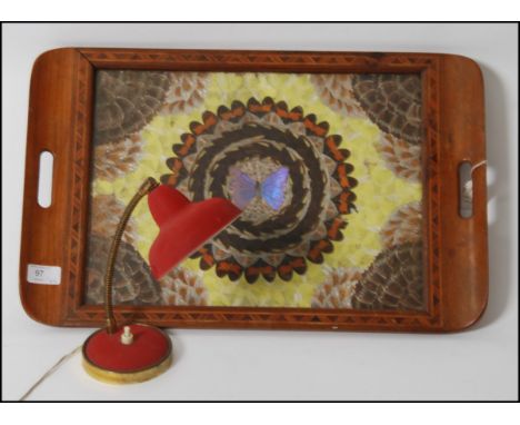 A small 1950's red and gilt metal anglepoise goose neck desk lamp together with a vintage mid century tray with inset butterf