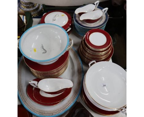A collection of Royal Worcester dinnerware, with red border together with a platter and soup dishes