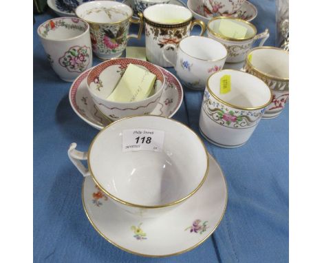 A collection of 19th and 20th century tea cups and coffee cans, two with saucers, some with cross swords mark to base