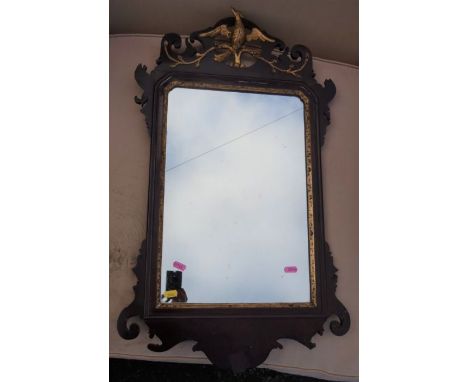 A Georgian design fret cut wall mirror, decorated with a gilded Ho-Ho bird, overall 31ins x 17.5ins, together with an oval ma