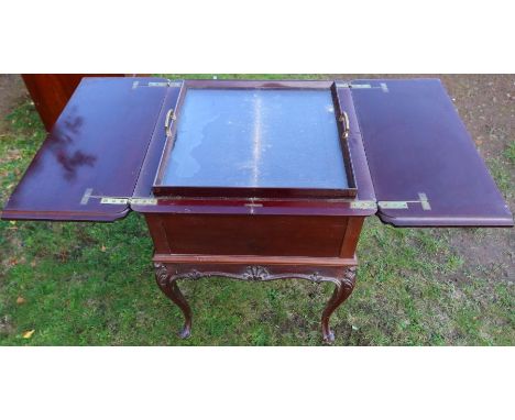 J Bagshaw &amp; Sons Liverpool, An Edwardian mahogany drinks table, of square form, the pair of flaps opening with rising rem