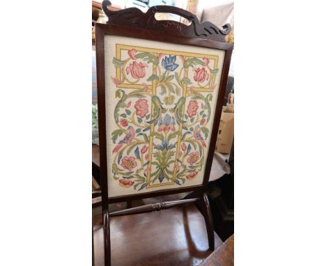 An embroidered fire screen