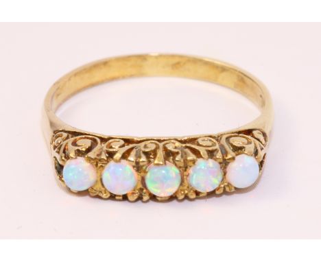 Five stone opal gold on silver ring   Condition Report   Click here for further images, condition, auction times & delivery c